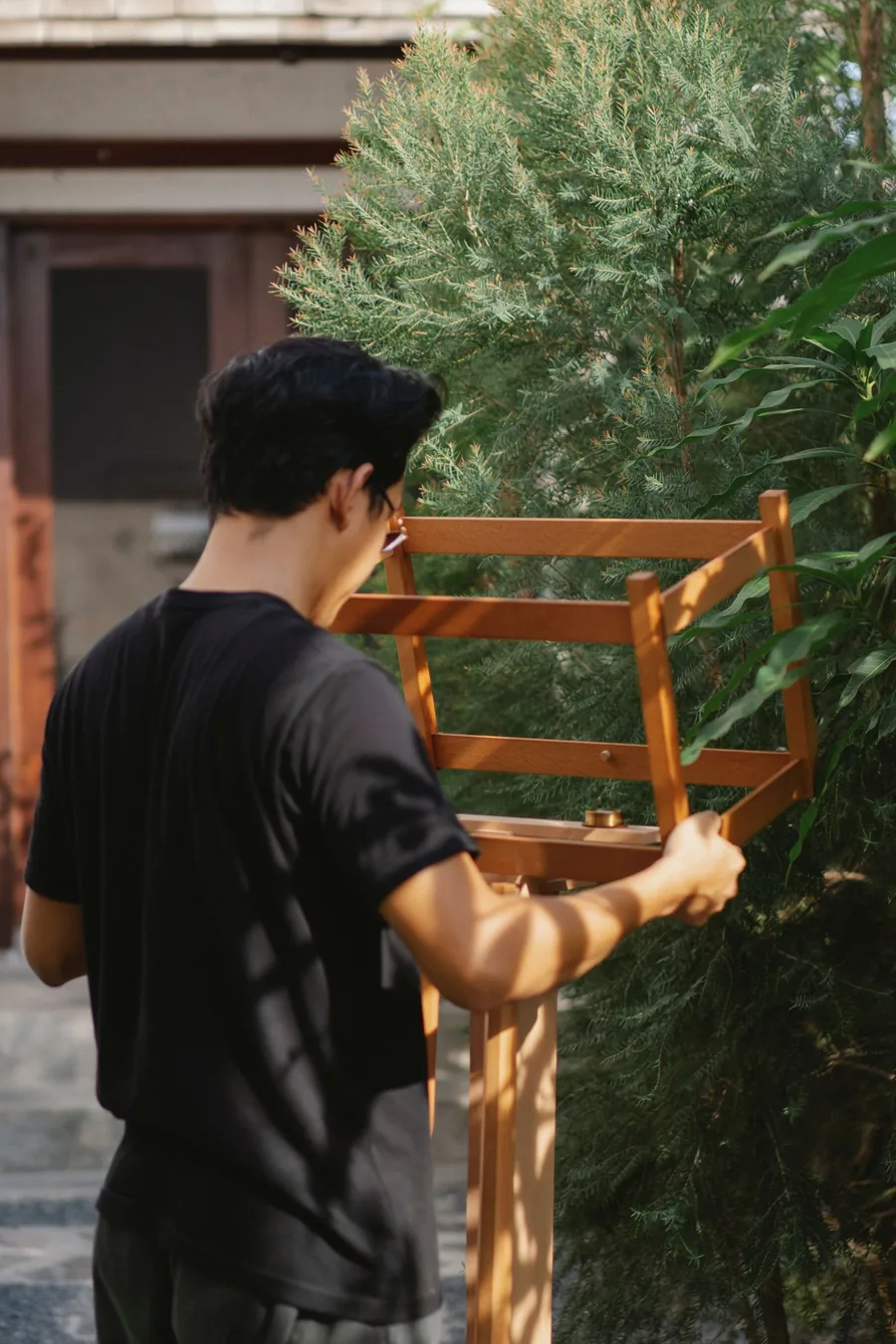 Carpenter repairing a wooden garden structure