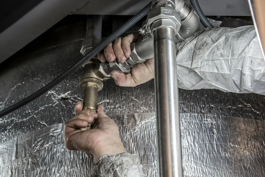 Plumber fitting new pipework